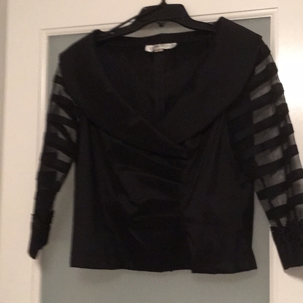 Black, mid-sleeve top and long matching skirt.